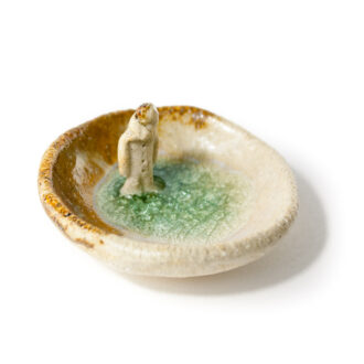 Cuenco de gres con niño dentro