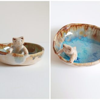 Cuenco con gato asomado